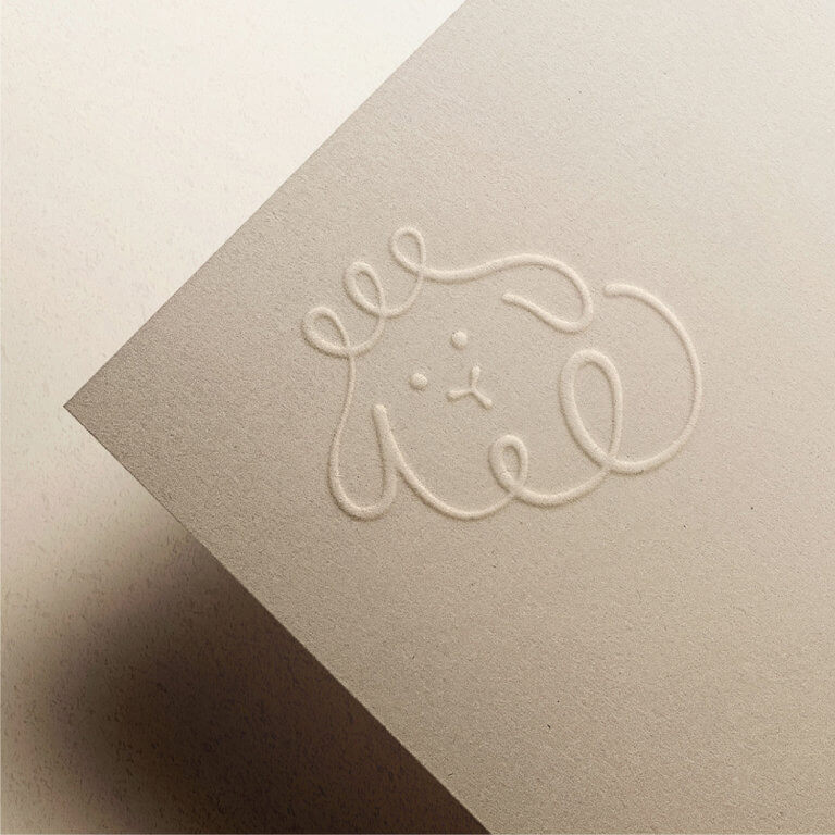 Embossed Lamb logo on paper